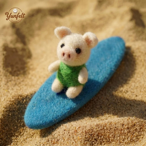 Pig in Swimsuit on Surfboard – Carefree Wool Felt Summer Figurine